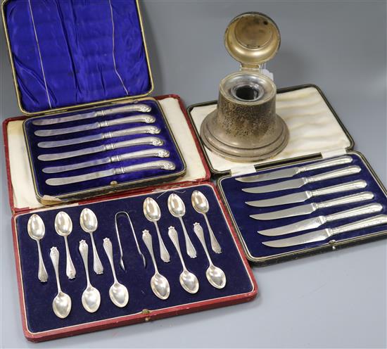 A 1920s silver bell shaped ink stand and three cased sets of flatware including silver teaspoons.